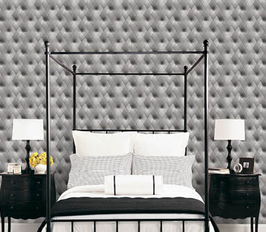 Bedroom with a buttonback in black and grey wallcovering