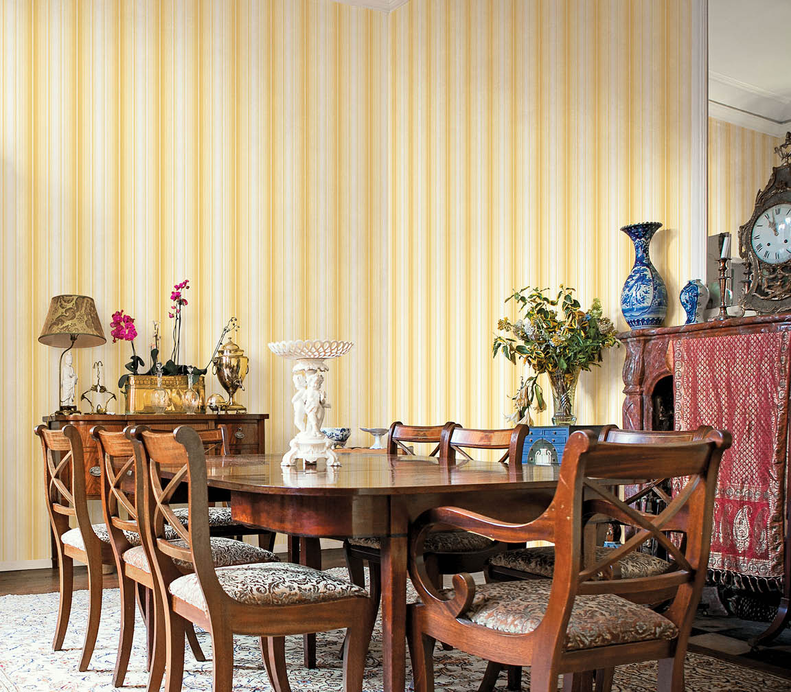 grand dining room with yellow stripe wallpaper