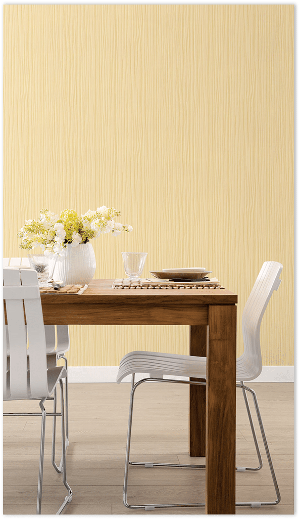 Yellow raffia texture wallpaper in a modern dining room  14 Nov 2012 --- White chairs at wooden dining table --- Image by   Hero Images Corbis