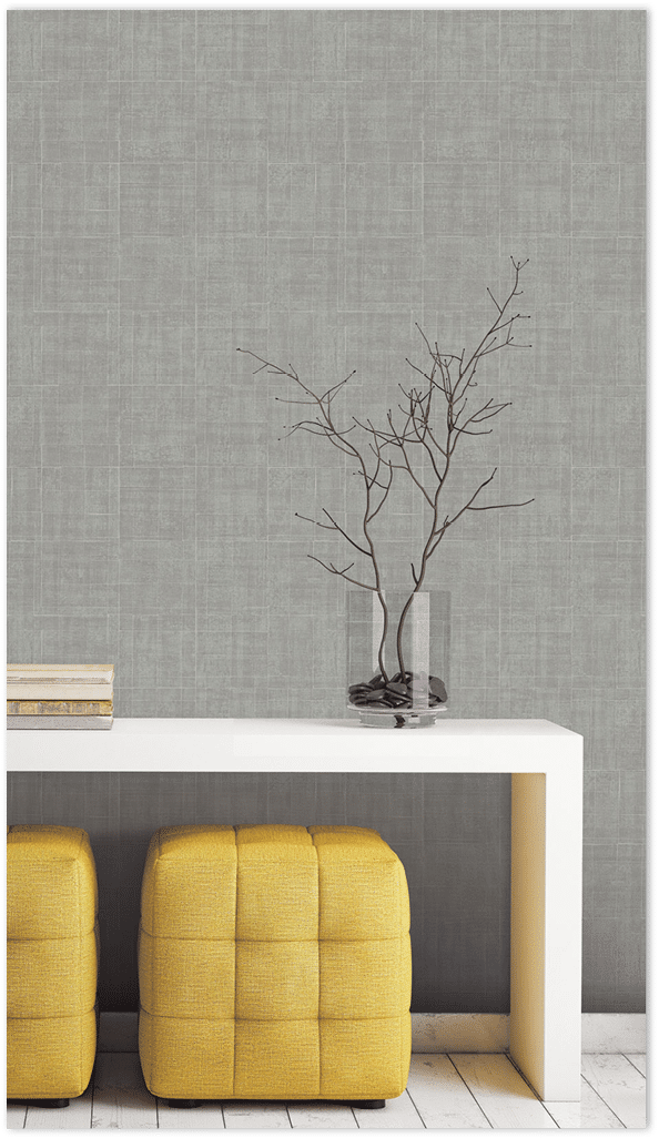 Grey Architectural texture wallpaper in a vignette with yellow ottomans and white table