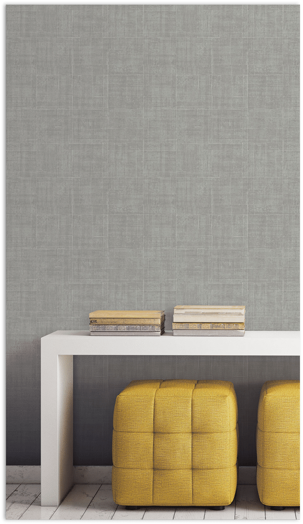Grey Architectural texture wallpaper in a vignette with yellow ottomans and white table