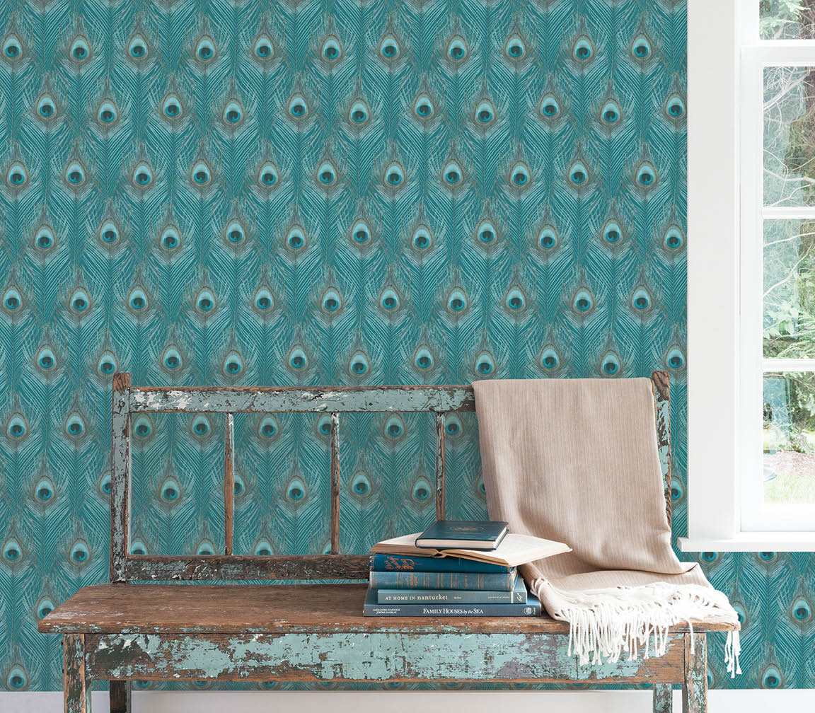 An interior space of bench by a window with teal peacock feather wallpaper