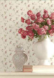 vignette with small print floral wallpaper and border in pinks, green and beiges