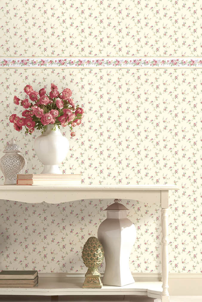 vignette with small print floral wallpaper and border in pinks, green and beiges
