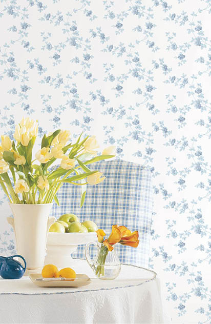 Blue floral trail on white wallpaper in a dining room