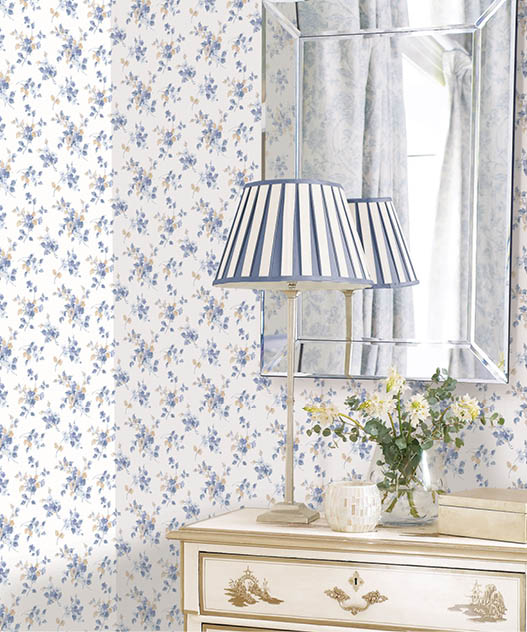vignette of blue, beige  and white floral trail wallpaper