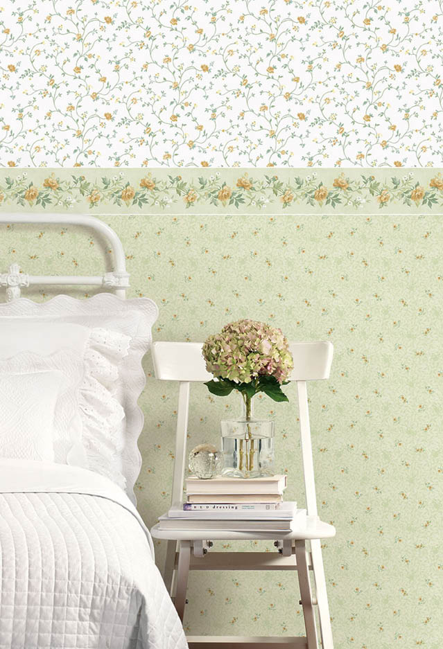 Bedroom with a green and yellow floral border, green floral and leaves wallpaper and a second wallpaper of a yellow and green floral trail