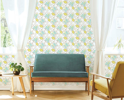 Real photo of a mid-century living room interior with a sofa, coffee table, windows and painting with retro geometric wallpaper in green and yellow