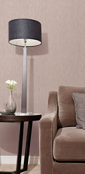 living room with light reflective taupe with blue specs string wallpaper