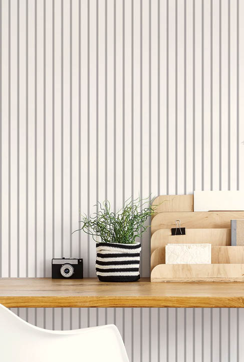Office with black and white ticking stripe wallpaper
